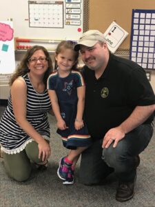 Joy and Greg at first day of kinder with daughter